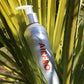 AirFro swim shampoo bottle in beach setting
