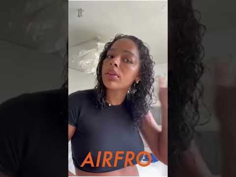 AirFro swim shampoo bottle in curly hair